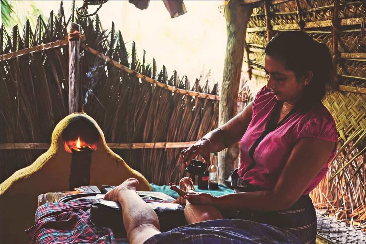 Purple cloths drying beside the Ayurveda massage pavilion at Ulpotha.